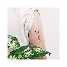 Minimalist Black And White Style Chopsticks Tattoo Inked On The Back Of The Right Upper Arm Chopsticks Tattoo Tattoos Body Art Tattoos