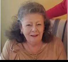 Celebrating 90th birthday of former teacher with cake and refreshments