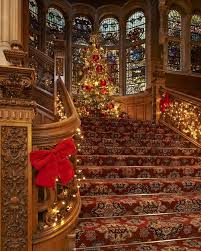 Festive Decorations Complement The Grand Baronial Interior Of The Castle S Great Hall As Christmas Day Draws Skibo Castle Castle Christmas Festival Decorations