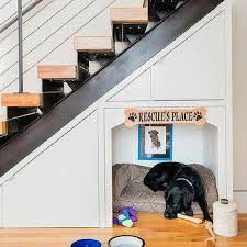 Not only is this storage idea fun to show people, but it also makes better use of the space under your stairs than most! Built In Dog Bed Under Stairs Design Ideas
