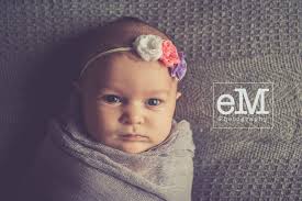 Check out this tiny beauty! She is wearing the same headband that her older  sister wore in her pictures about a year and a half ago! How gorgeous are  those eyes?!