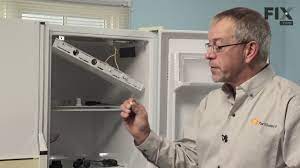Release the defrost heater from the freezer coils. Kenmore Refrigerator Repair How To Replace The Defrost Timer Youtube