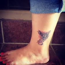 Grey Ink Flying Phoenix Tattoo On Left Ankle Tattooshunt Com Tatu