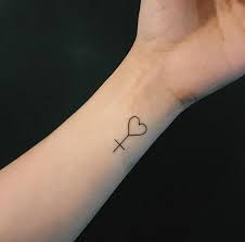 The symbol of the cross has been used in diverse. 19 Pretty Cross Heart Tattoo Design Ideas Entertainmentmesh