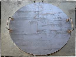 A stainless steel handle is welded to the top of this cover for fire pits and is finished to match the rest of the lid. Snuffer Lid Mann Made Fire Pits