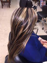 If you are looking to put blonde highlights on dark hair, this is a great option. Chunky Highlights Lowlights Hair Styles Hair Color Shades Winter Hairstyles