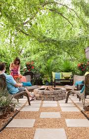 Make Your Patio A Destination All Year Long A Stone Ringed Firepit Surrounded By Comfortable Woven Chairs And Co Backyard Fire Outdoor Fire Pit Small Fire Pit