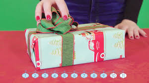 Unroll the wrapping paper onto a smooth surface and lower the top half of the box onto the paper. How To Wrap A Gift Wrapping A Present Step By Step Instructions With Pictures