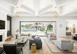 Large Great Room Furniture Layout Ideas This Large Great Room Features Two Distinct Sitting Areas Furniture Layout Large Living Room Layout Great Room Layout