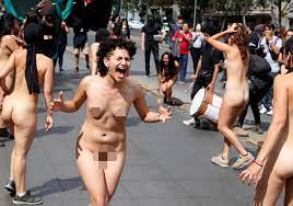 Naked women take part in a rally marking international day to end violence  against women amid ongoing protests in Chile – The Sun | The Sun