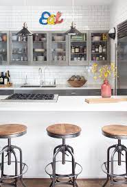 Starting at $ 2589 $ 1941.75. Gray Glass Door Kitchen Cabinets With White Subway Tiles Contemporary Kitchen