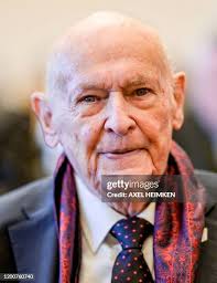 93-year-old former SS guard Bruno Dey covers his face next to a... News  Photo