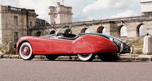Back Of A Beautiful Red And Black 1953 Jaguar Xk 120 Ots Roadster With White Wall Tires In Front Of The Chateau De Vincennes Best Classic Cars Jaguar Jaguar Xk