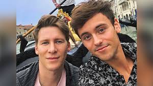 Tom Daley and Dustin Lance Black share adorable family portrait with baby  Robbie Ray