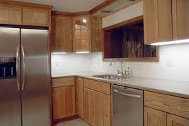 Old cabinets can be brought into the modern age with a coat of paint. Refacing Vs Replacing Kitchen Cabinets