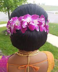 Beautiful Fresh Orchid Flowers On A Classic Low Bun Updo With Naturally Teased Hair On Top Love How It Turned Out Teased Hair Low Bun Updo Brunette Hair Color