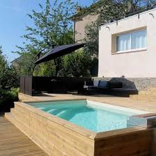 Installer Une Piscine Dans Un Terrain En Pente La Preuve En Photo Avec Cette Piscine Sem Terrasse Surelevee Amenagement Jardin En Pente Amenagement Piscine