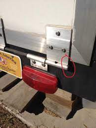 It could be clamped down, but we just use bungies at the ends by the door opening to keep it from slipping around. Ramp Door Spring Keystone Rv Forums