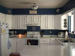 Kitchen Design Dark Blue Wall Paint Color For G Shaped Kitchen With White Cabinet And Double Bowl Sta Blue Kitchen Walls Kitchen Cabinet Design Kitchen Design