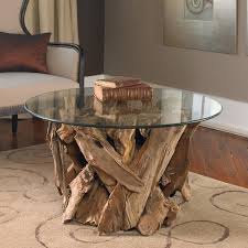 Such a table puts together two key elements: Teak Driftwood Round Glass Coffee Table