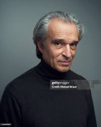 Writer Bernard Rigaud poses for a portrait