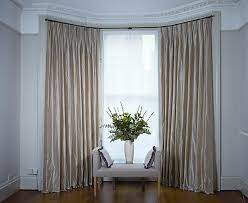 There are many times a radiator in the centre of the bay. Dressing Bay Windows With Curtains And Blinds
