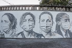 Vhils Pays Tribute To Healthcare Workers By Chiseling Portraits Of These Masked Heroes Into A Hospital Wall Street Art Public Artwork Street Art News