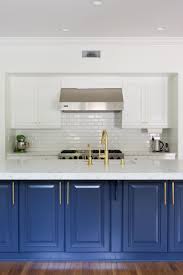 See How A Party Stylist Translates Her Cool Girl Style Into Her L A Home Blue Kitchen Decor Blue Kitchen Cabinets Blue Kitchens