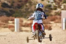 Kids Learning To Ride Dirt Bikes With Training Wheels Outdoor Sports For Kids Who Love Ad Bike With Training Wheels Kids Riding Dirt Bikes Dirt Bikes For Kids