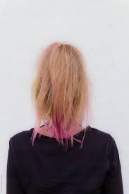 Dyeing your hair pink is a great way to change up your style. Blonde Hair With Pink Ends By Gillian Vann Stocksy United