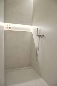 Lush greenery covers the wall just behind the white oval bathtub. Master Bathroom Unique Design Bathroom Layout Bathroom Design Interior Design School