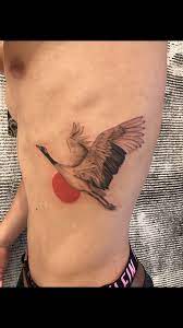 Crane And Rising Sun Done By Azusa At Tokyo Three Tides Tattoo In Tokyo Japan Shibuya Crane Tattoo Body Art Tattoos Nerd Tattoo