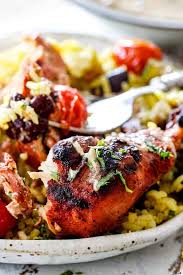 A Plate Of Partially Eaten Grilled Tandoori Chicken With Rice Beans Tomatoes And Yogurt Dip Chicken Fillet Recipes Chicken Chicken Recipes