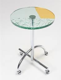 Because tempered glass can't be sized down easy the only choice is to size the glass to the table. Kuramata Shiro Sally Table 1987 Mutualart