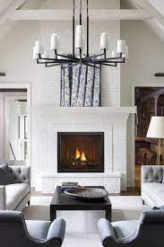 a painted white brick fireplace surround makes for a stunning backdrop for our true gas fireplace ava white brick fireplace gas fireplace red brick fireplaces