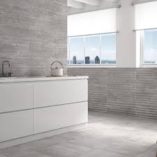 The soft sepia tones of this travertine tile add warmth to this kitchen design. National Tile Kitchen Wall Tiles