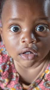 …and they are looking at you! , But baby Uwase has a lot to smile about.  Through point-of-care early infant diagnosis, his mother was able to get  the test results declaring him HIV-free in one hour. ...