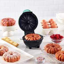 In a large bowl, sift together 2 1/4 cups of flour, baking soda, and salt. Mini Bundt Cake Pan Dash