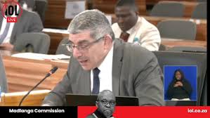 Len Barnabas John from IPID presented a recording of a phone call between Bevan Loftus and Clive Naicker. In the call, Loftus directly accuses Naicker: "You are paying Dino Govender to do all this ...