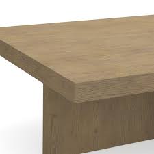 The table's clean lines reflect meticulous attention to detail and artisanal craftsmanship. Oak Plank Rectangular Coffee Table Williams Sonoma