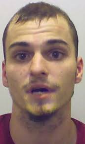 Drug suspect's twin faces gun threat charges