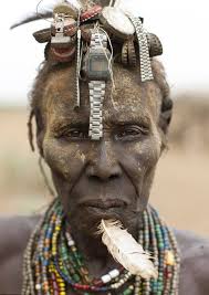 An Ethiopian ethnic headtooi, from the Arrussi/Negelle area. this one is  from 1950s made up of Italian White heart beads and Italian skunk(eye  beads, mostly red and black, unusual it to be