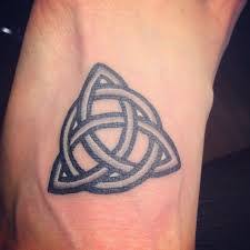 The celtic spiral, a symbol of the trinity, looks beautiful in thick black lines. What Does Trinity Tattoo Mean Represent Symbolism