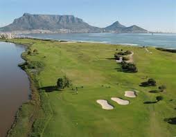 Milnerton Golf Club With Table Mountain And Table Bay In The Background And The Milnerton Lagoon On The L Cape Town Tourism Cape Town South Africa Golf Courses