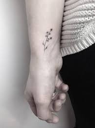 The meaning is represented in the life of a lotus flower as it grows through the mud, yet maintains pure as it blooms on the water's surface. Small Hand Poked Flower Tattoo On The Wrist Tattoogrid Net