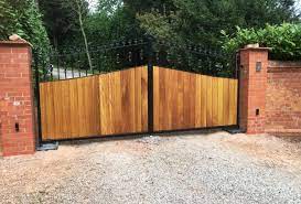 Sliding metal gates with wood infill. Residential Electric Driveway Gates By The Electric Gate Company Electric Gate Company