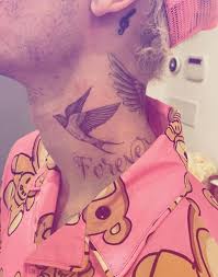 The tattoo is an image of the seagull from the fable jonathan livingston seagull and is inked on many of the men of the. Justin Bieber Shows Off New Forever Tattoo On His Neck