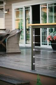 Make your top rail wide enough to hold a drink cup or a small planter. Modern Deck Railing And Reclaimed Wood Posts Cable Railing Deck Modern Deck Diy Deck