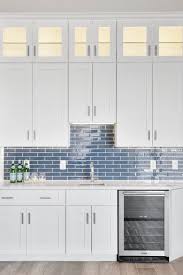 Do You Prefer A Wet Bar That Is Separate From The Kitchen Or An Extension Of The Space We Love Blue Backsplash Kitchen Custom Kitchen Cabinets Home Kitchens