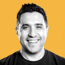 What type of merchandise do comedians sell at shows or online?